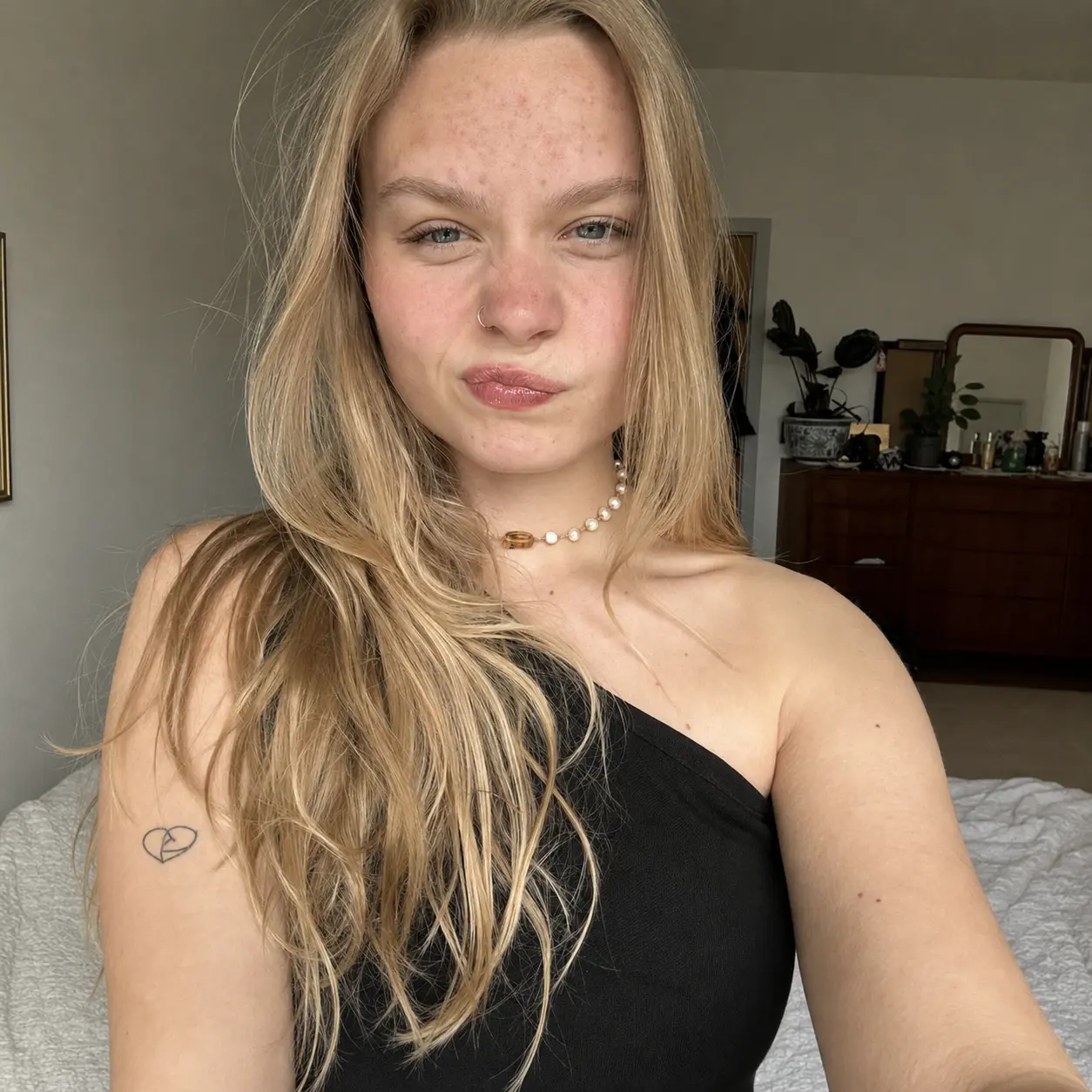 Unretouched blonde selfie with natural skin texture