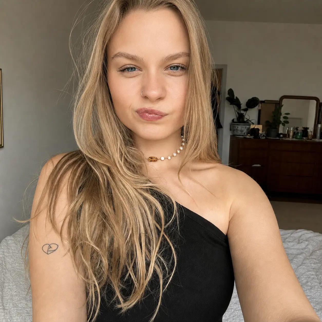 Blonde selfie after an AI beauty filter edit