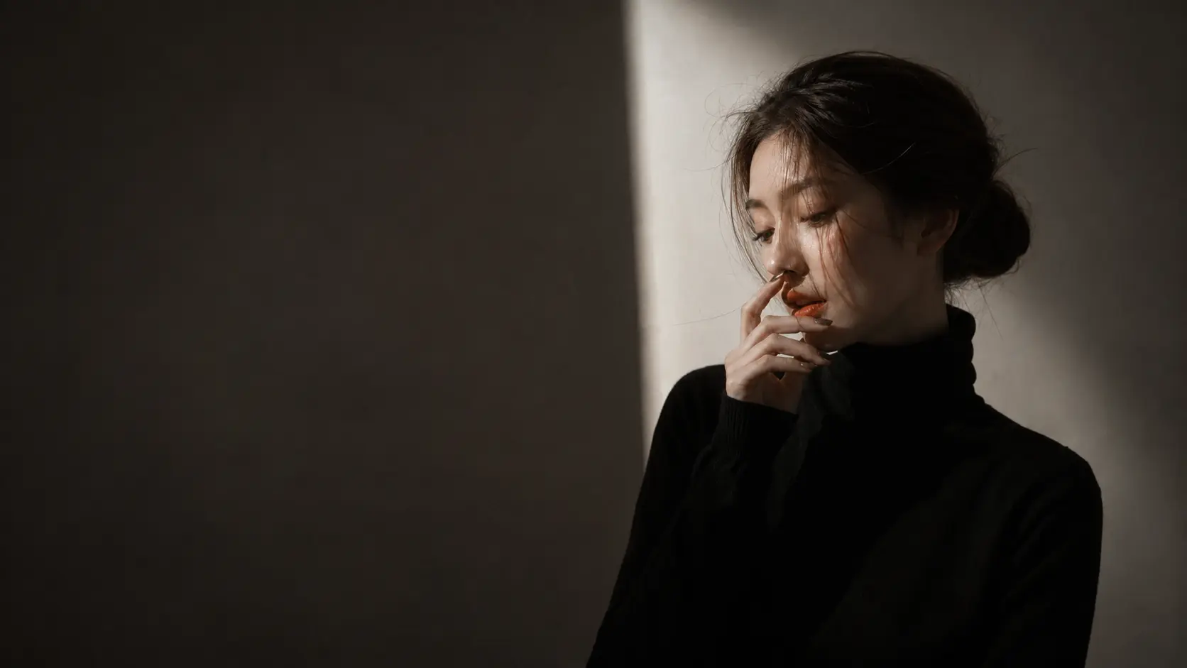 The same low-light portrait with visible noise reduced.