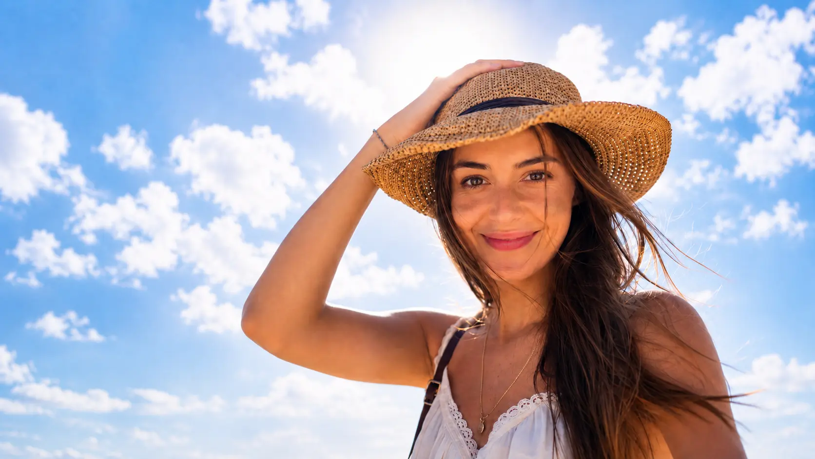 The same sunny beach portrait after AI opened the subject's eyes naturally.