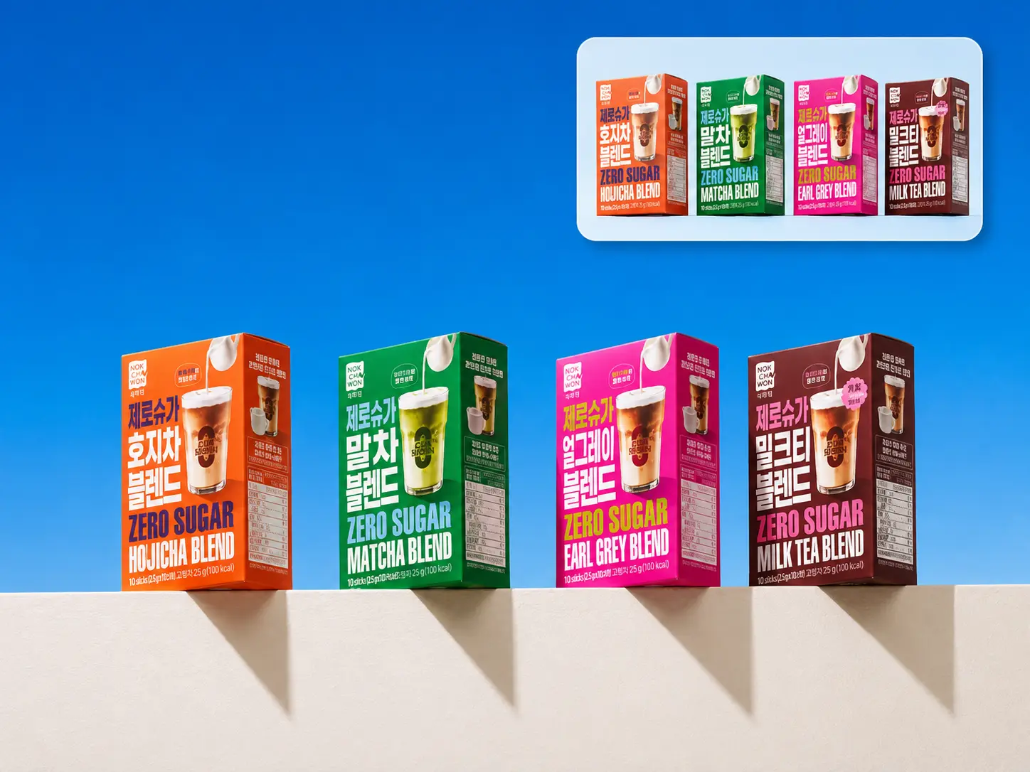 Four colorful zero-sugar drink mix boxes staged against a bright blue studio background.