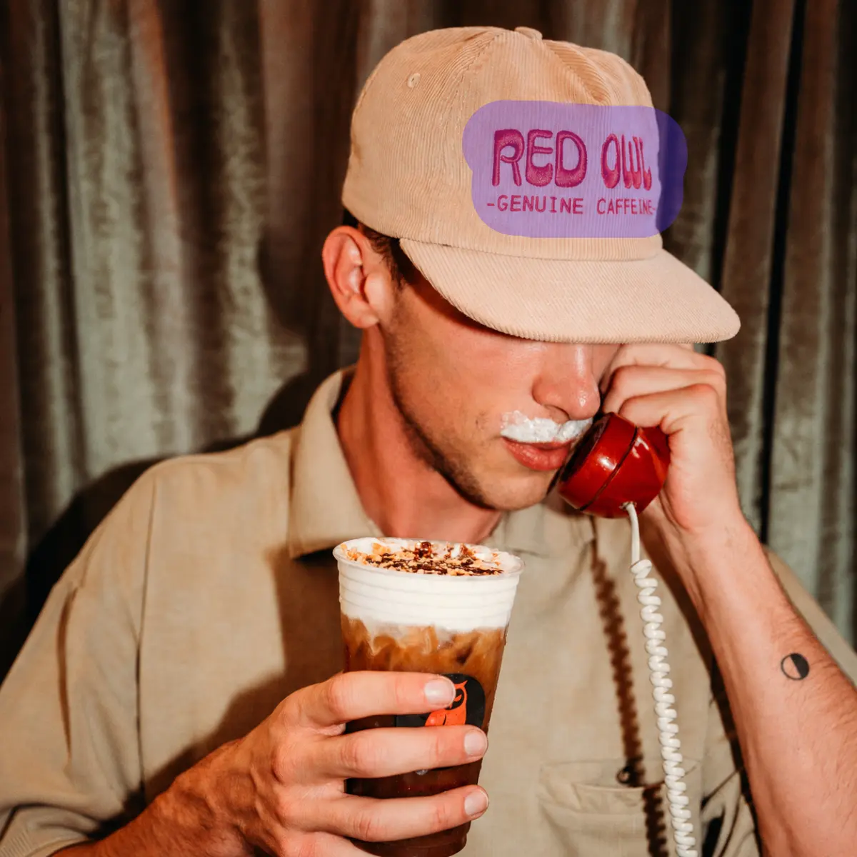 Portrait with text on a cap marked for removal