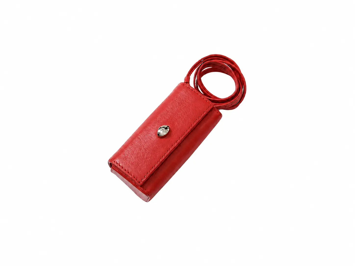 Red leather accessory isolated on white before a product shadow is added.