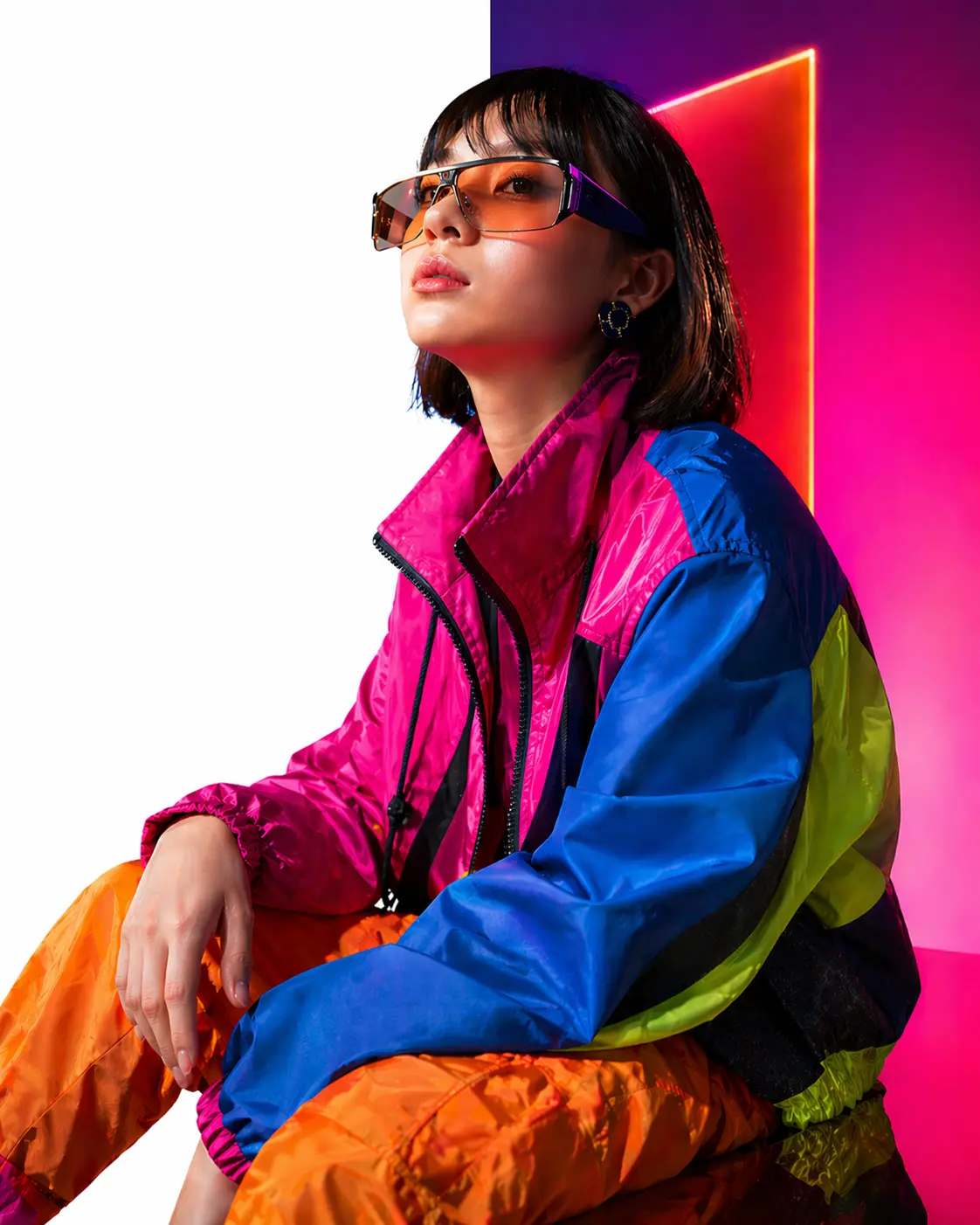 Portrait split between a vivid original studio scene and a clean white-background result.